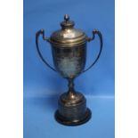 A WHITE METAL LIDDED TROPHY - 'THE CHALLENGE CUP' DATED 1977