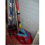 TWO SETS OF SKIS AND A PAIR OF SKI BOOTS