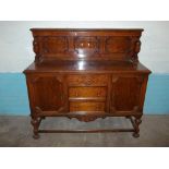 AN OAK VINTAGE SIDEBOARD