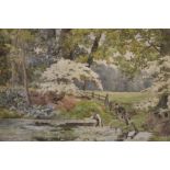 AN ANTIQUE FRAMED AND GLAZED WATERCOLOUR OF FIGURES IN A STREAM SIGNED ROBERT E GROVES LOWER LEFT