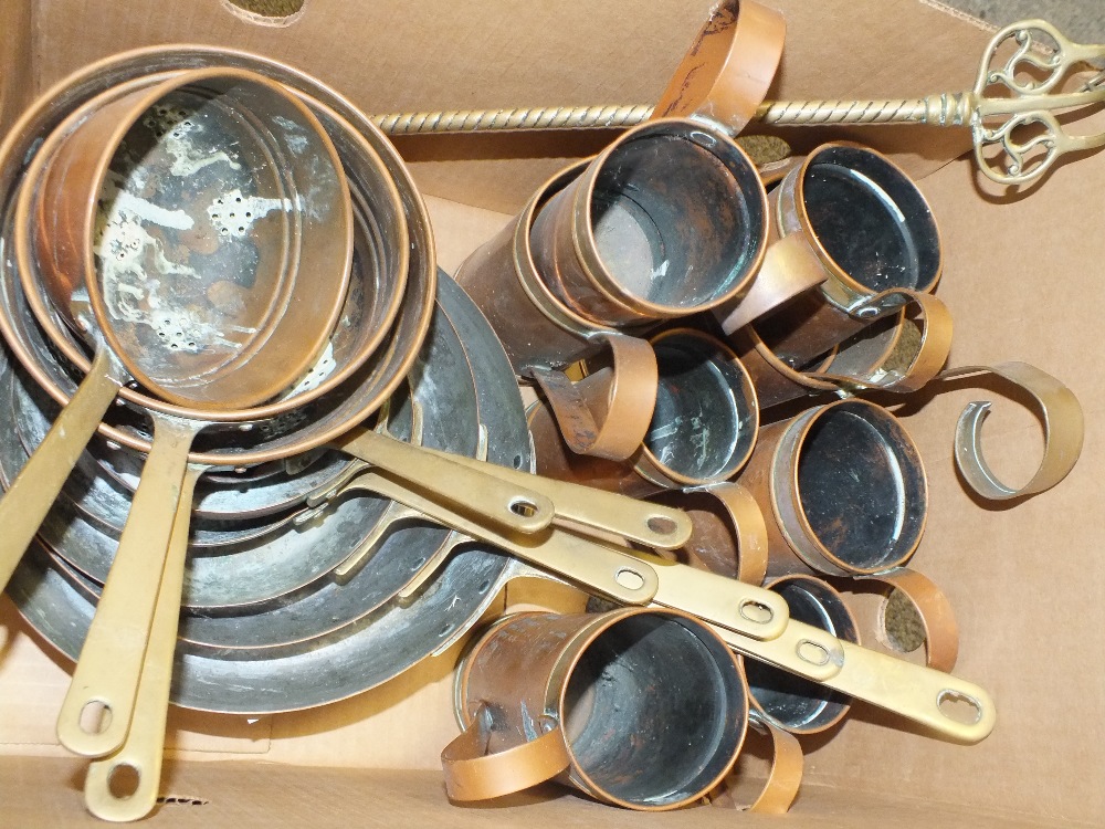 A COLLECTION OF VINTAGE COPPER MEASURES AND SAUCEPANS