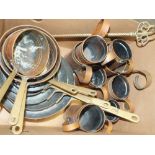 A COLLECTION OF VINTAGE COPPER MEASURES AND SAUCEPANS