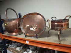 A LARGE COPPER HELMET SHAPED COAL BUCKET, TOGETHER WITH A TWIN HANDLED SERVING TRAY AND A SMALL