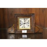 A VINTAGE CARVED OAK MANTEL CLOCK WIDTH - 31CM