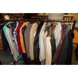 A RAIL OF MOSTLY VINTAGE AND MODERN LADIES CLOTHING TO INCLUDE FUR AND FAUX FUR COATS ETC