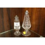 A WATERFORD CRYSTAL PEPPERETTE TOGETHER WITH ANOTHER PEPPERETTE (2)