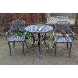 A CIRCULAR METAL GARDEN TABLE AND TWO CHAIRS