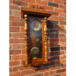 A VICTORIAN MAHOGANY CASED VIENNA WALL CLOCK WITH KEY