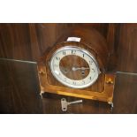 AN ART DECO INLAID WALNUT MANTEL CLOCK WITH KEY