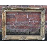 A 19TH CENTURY GOLD SWEPT FRAME FOR RESTORATION, frame W 8 cm, rebate 67 x 47 cm