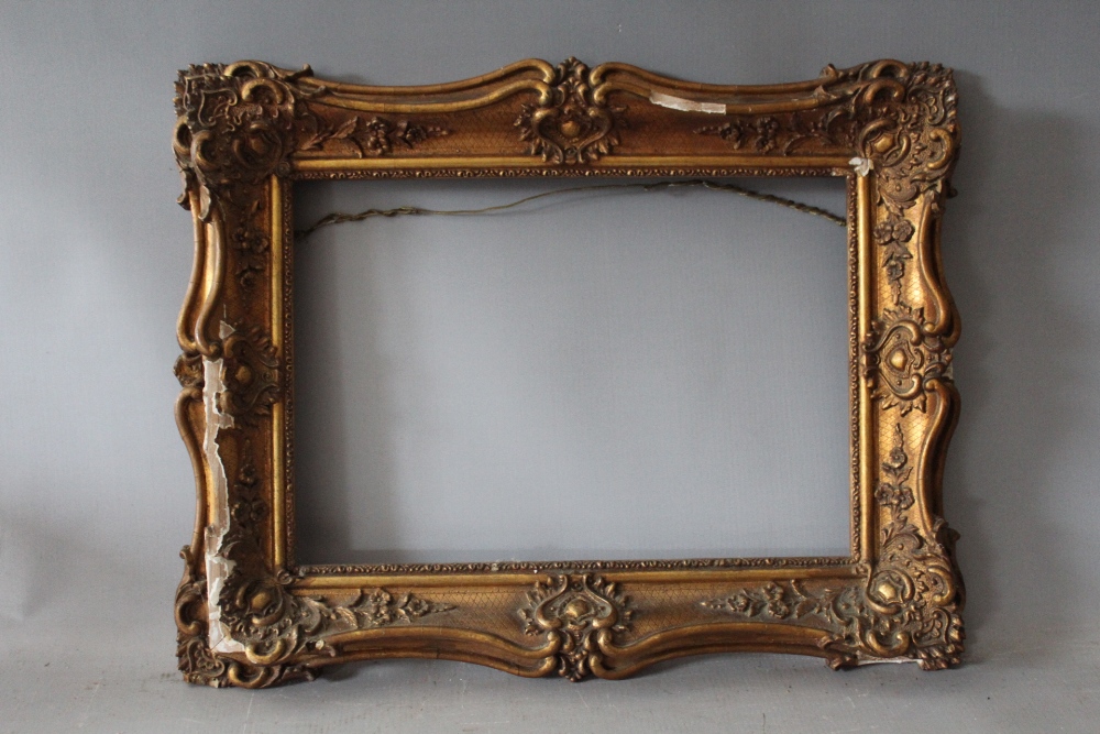 A 19TH CENTURY GOLD SWEPT FRAME FOR RESTORATION, frame W 7 cm, rebate 24 x 35 cm