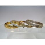 FOUR VINTAGE SILVER AND GOLD PLATED HINGED BANGLES, comprising an octagonal example marked 925, a