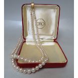 A VINTAGE CIRO TWIN STRAND PEARL NECKLACE, the graduating beads terminating with a 9 ct gold clasp