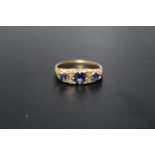 AN UNMARKED GOLD SAPPHIRE AND DIAMOND DRESS RING, ring size Q, approx weight 4.3 g