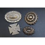 FOUR ASSORTED VINTAGE HALLMARKED SILVER AND WHITE METAL BROOCHES, largest W 4.5 cm