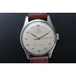 A GENTS TUDOR ROLEX ROYAL WRISTWATCH, the cream face with Arabic numerals and minute markers, dia.