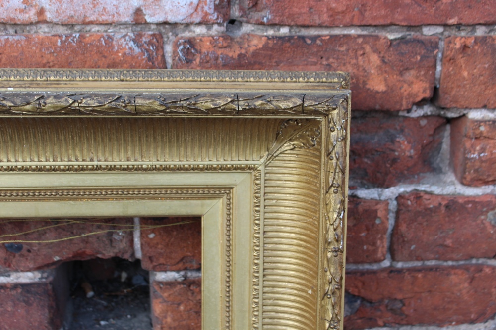 A 19TH CENTURY GILT REEDED PICTURE FRAME, plain slip. W 12 cm, rebate 68 x 52 cm A/F