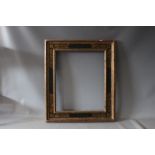 A 19TH CENTURY GOLD FRAME WITH INNER GOLD DECORATIVE SCROLLWORK, frame W 10 cm, rebate 57 x 47 cm
