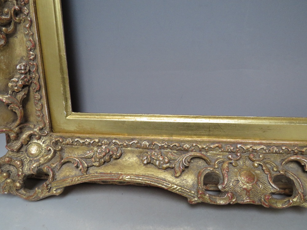 A 19TH CENTURY PIERCED AND SWEPT GOLD FRAME WITH GOLD SLIP, frame W 8 cm, slip rebate 314 x 48.5 cm, - Image 4 of 6
