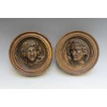 A PAIR OF CARVED WOODEN ROUNDELS, Dia 18 cm