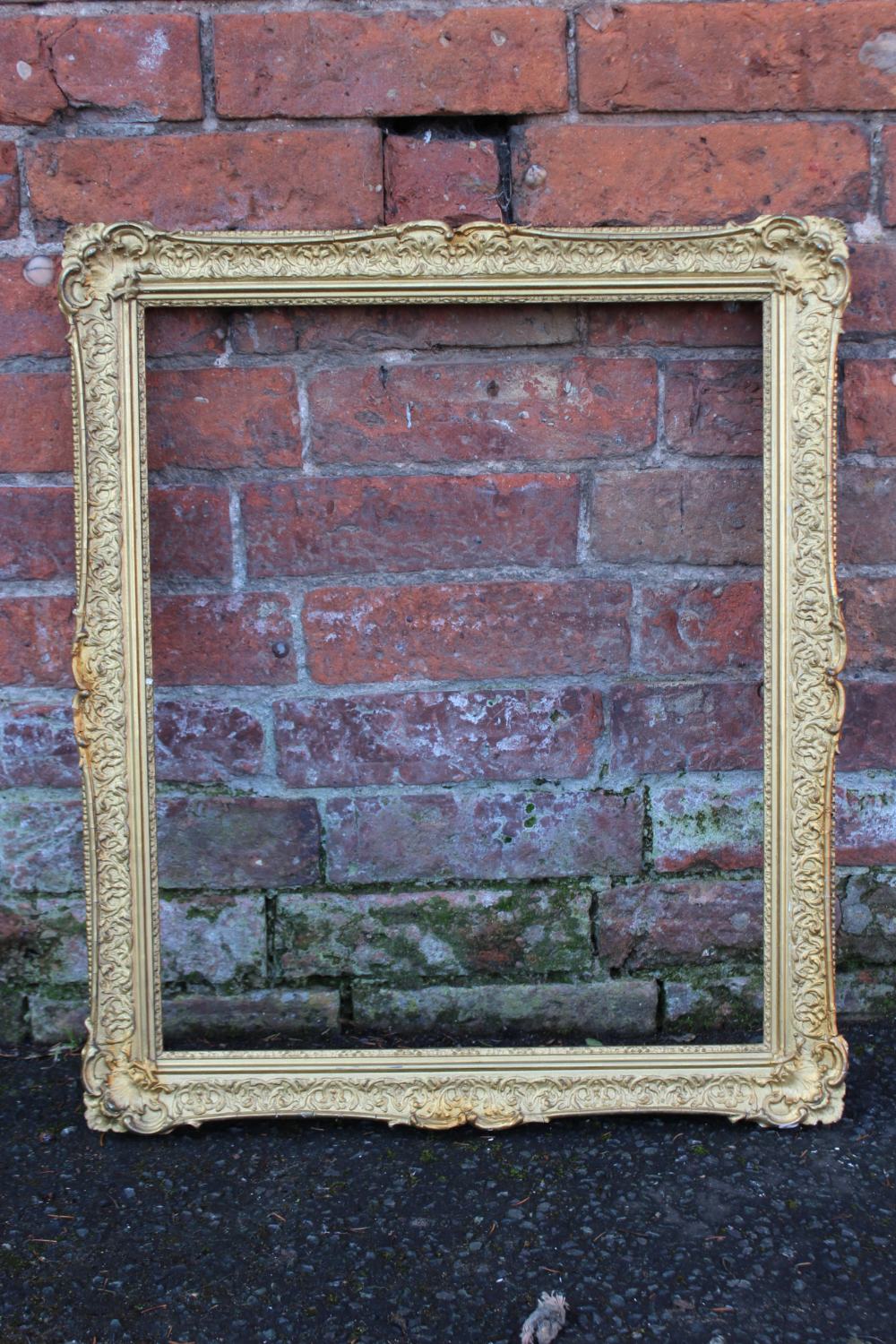 A 19TH CENTURY DECORATIVE GOLD FRAME WITH CORNER EMBELLISHMENTS, frame W 5.5 cm, rebate 54 x 44 cm