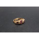 A HALLMARKED 15 CARAT GOLD SEED PEARL AND AMETHYST RING, approx weight 1.7g, ring size N