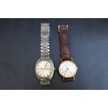 A RETRO SEKONDA DAY DATE AUTOMATIC WRIST WATCH, Dia 4 cm together with a quartz example (2)