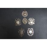 A COLLECTION OF FIVE HALLMARKED SILVER FOBS, together with one stamped 'SILVER' and 'IRISH MADE'