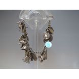 A VINTAGE SILVER CHARM BRACELET AND CHARMS, rubbed lion passant marks to links, marked silver to