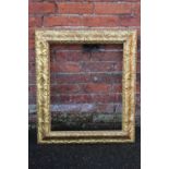 A 19TH CENTURY DECORATIVE GILDED FRAME, frame W 9 cm, rebate 61 x 51 cm