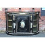 A VICTORIAN EBONISED CREDENZA, having central single door with an inset oval Continental porcelain