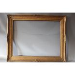 AN EARLY 20TH CENTURY GOLD SWEPT FRAME, with gold slip, frame W 8 cm, slip rebate 88 x 66 cm,