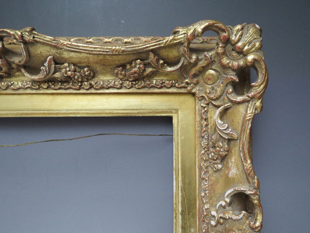 A 19TH CENTURY PIERCED AND SWEPT GOLD FRAME WITH GOLD SLIP, frame W 8 cm, slip rebate 314 x 48.5 cm, - Image 2 of 6