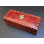 AN ITALIAN GILT LEATHER STAMP BOX, with later applied medallion of Queen Victorian, stamped G papini