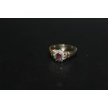 A HALLMARKED 9 CARAT GOLD RUBY CLUSTER RING, approx weight 2.4g, ring size O