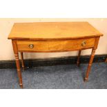 A VICTORIAN MAHOGANY BOW FRONT HALL TABLE, with single frieze drawer, raised on ring turned