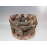 A VINTAGE PRE-COLUMBIAN STYLE SMALL POTTERY BOWL SURROUNDED BY SEVEN FIGURES, H 18 cm, base and