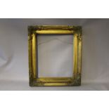 A NINETEENTH CENTURY GOLD FRAME, with corner embellishments, width of frame 7 cm, rebate 44 x 37 cm