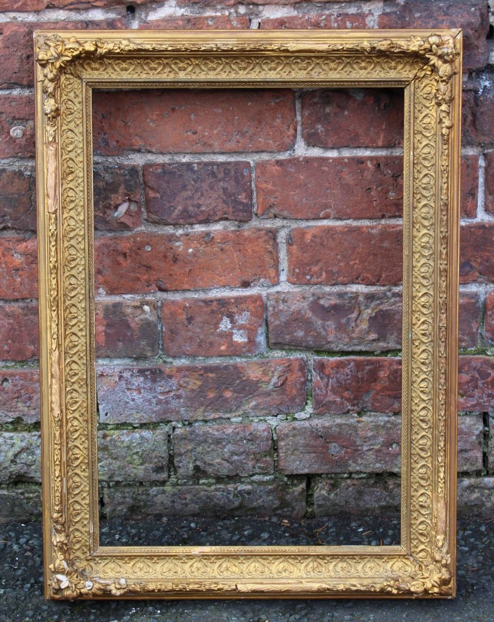 A 19TH CENTURY DECORATIVE GOLD FRAME WITH SOME RESTORATION, frame W 6 cm, rebate 51 x 34 cm