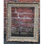 AN EARLY 20TH CENTURY CARVED WOODEN DECORATIVE GOLD FRAME, frame W 7 cm, rebate 44 x 34 cm