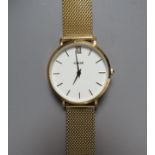 A MODERN GOLDTONE CLUSE WRISTWATCH, the white face with Roman numerals, Dia. 3.2 cm, contained in