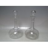 A PAIR OF ANTIQUE GLOBE AND SHAFT STAR CUT DECANTERS, with original hollow blown engraved stoppers