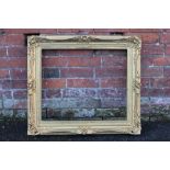 A 19TH CENTURY GOLD SWEPT FRAME, with some restoration, with integral slip, frame W 9 cm, rebate