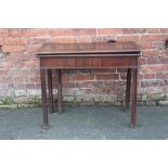 A 19TH CENTURY MAHOGANY FOLD-OVER CARD TABLE, raised on square supports, H 74 cm, W 91 cm