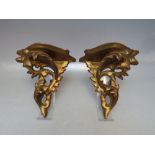 A PAIR OF ANTIQUE GILTWOOD WALL BRACKETS, overall height 17.2 cm, width 18 cm, depth 8 cm