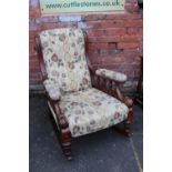 A VICTORIAN OAK OPEN GENTLEMANS ROCKING ARMCHAIR, with contemporary floral upholstery