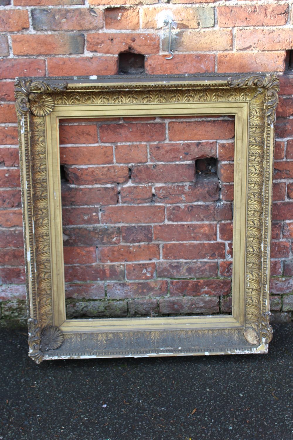 A 19TH CENTURY GILT PICTURE FRAME, plain slip, with acanthus moulded detail, frame W 14 cm, rebate