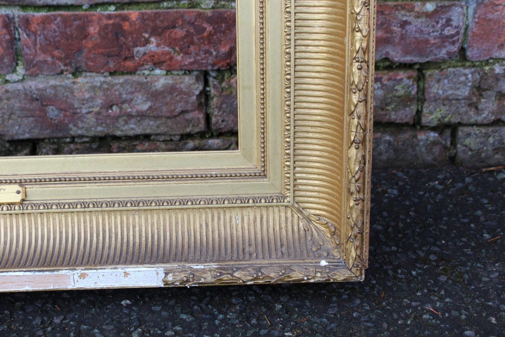 A 19TH CENTURY GILT REEDED PICTURE FRAME, plain slip. W 12 cm, rebate 68 x 52 cm A/F - Image 5 of 6