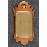 A 19TH CENTURY WALNUT PIER MIRROR OF TYPICAL SHAPED OUTLINE, with a gilt pierced basket of