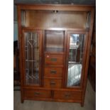 A MODEN OAK MIRRORED DISPLAY CABINET